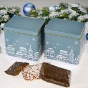 Christmas tins surrounded by rectangular Nuremberg Elisen gingerbread cookies and Christmas decorations Christmas tins surrounded by rectangular Nuremberg Elisen gingerbread cookies and Christmas decorations